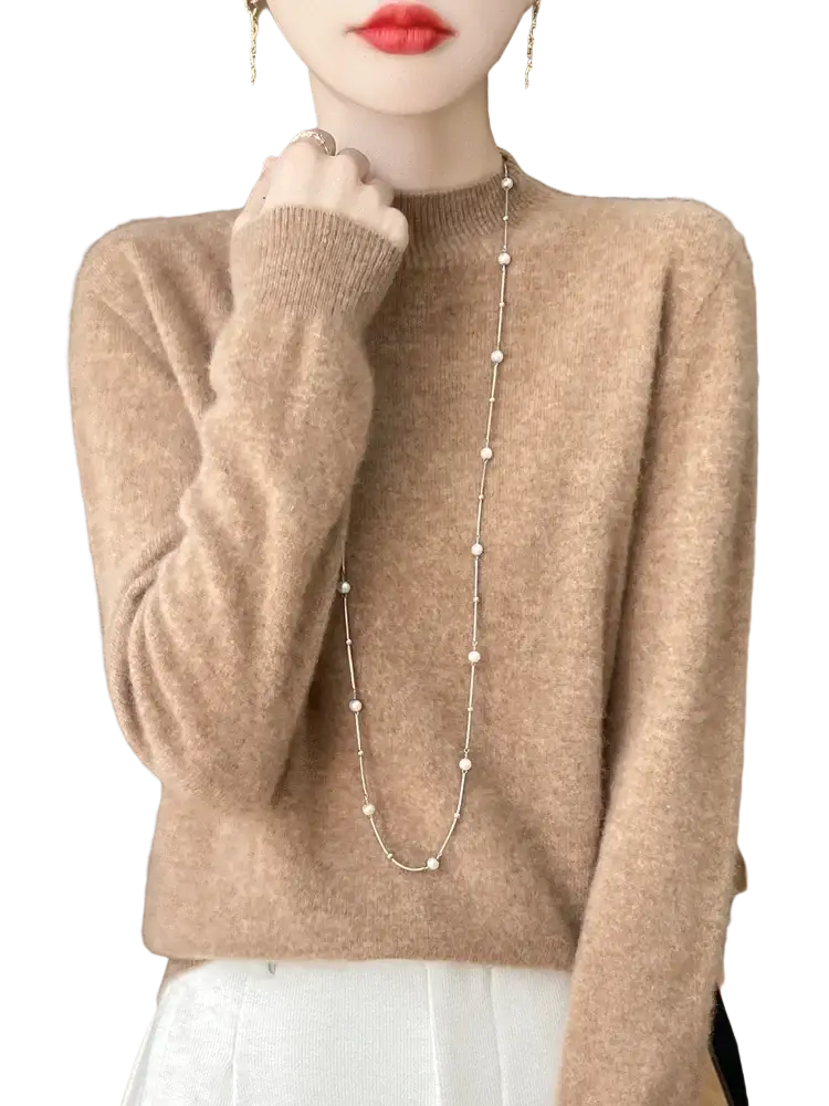 A soft beige cashmere sweater with ribbed neckline and cuffs in a merino wool pullover sweater for women