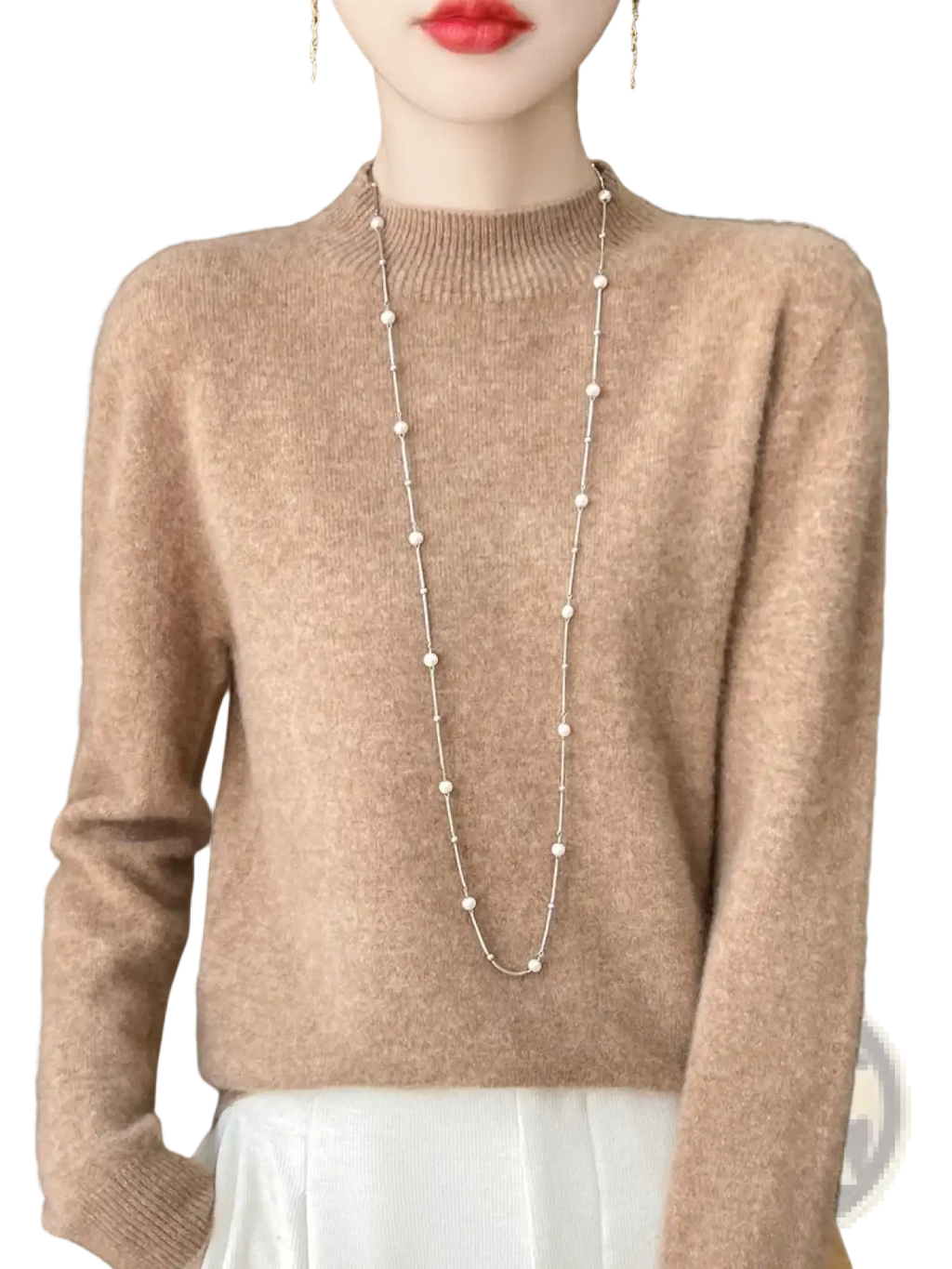 A soft beige cashmere sweater with ribbed crew neckline and long sleeves in a merino wool pullover style for women
