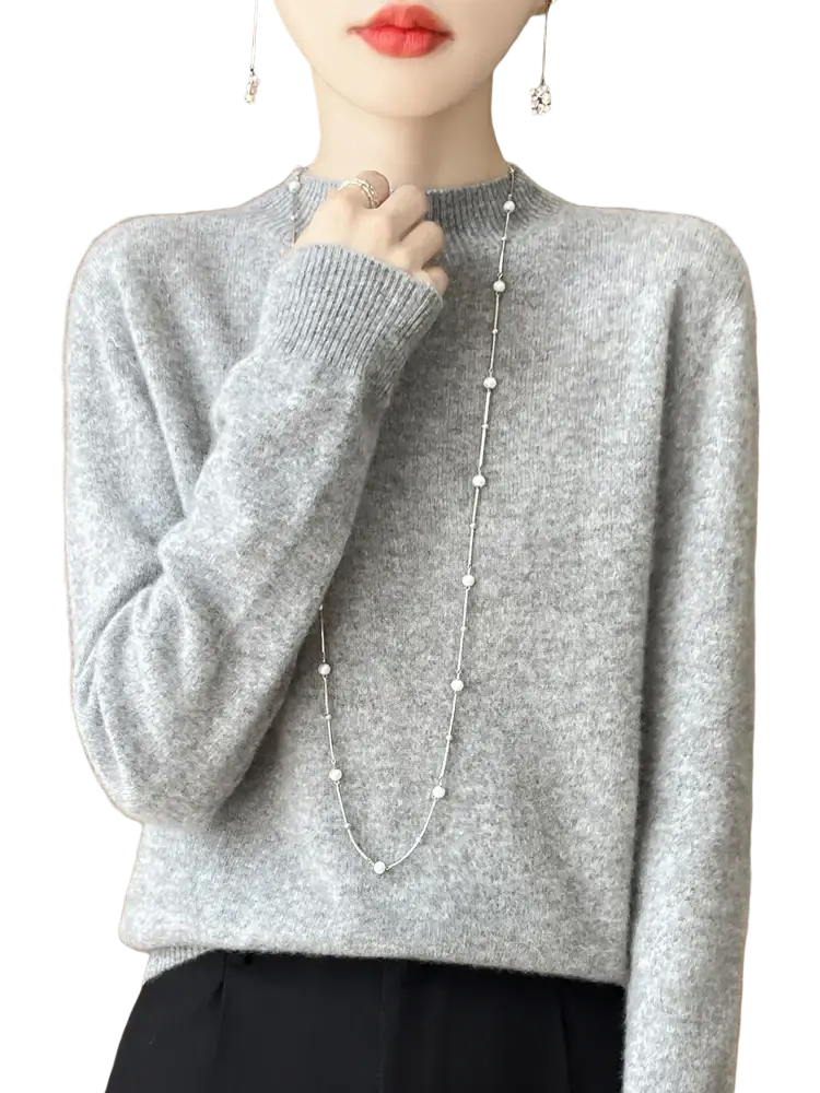 A soft heathered gray merino wool pullover sweater for women with ribbed neckline and cuffs
