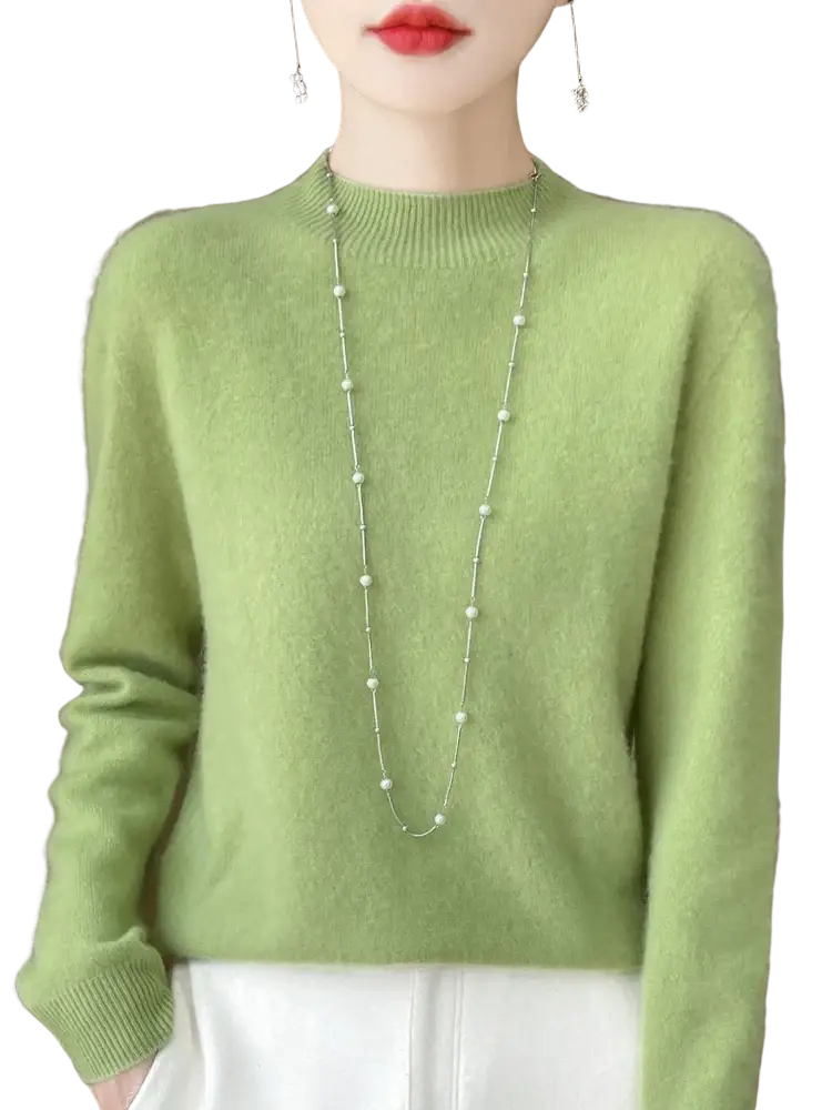 A soft light green cashmere sweater with ribbed crew neckline and cuffs in merino wool pullover style for women