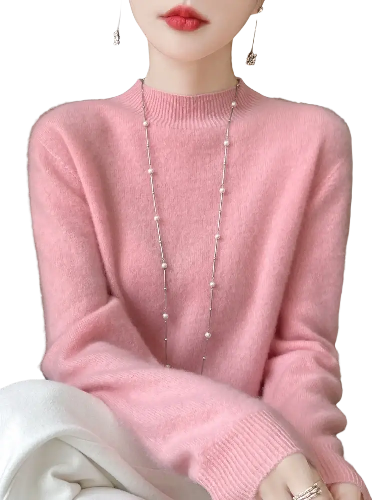 A soft pink merino wool pullover sweater for women with long sleeves and ribbed crew neckline and cuffs