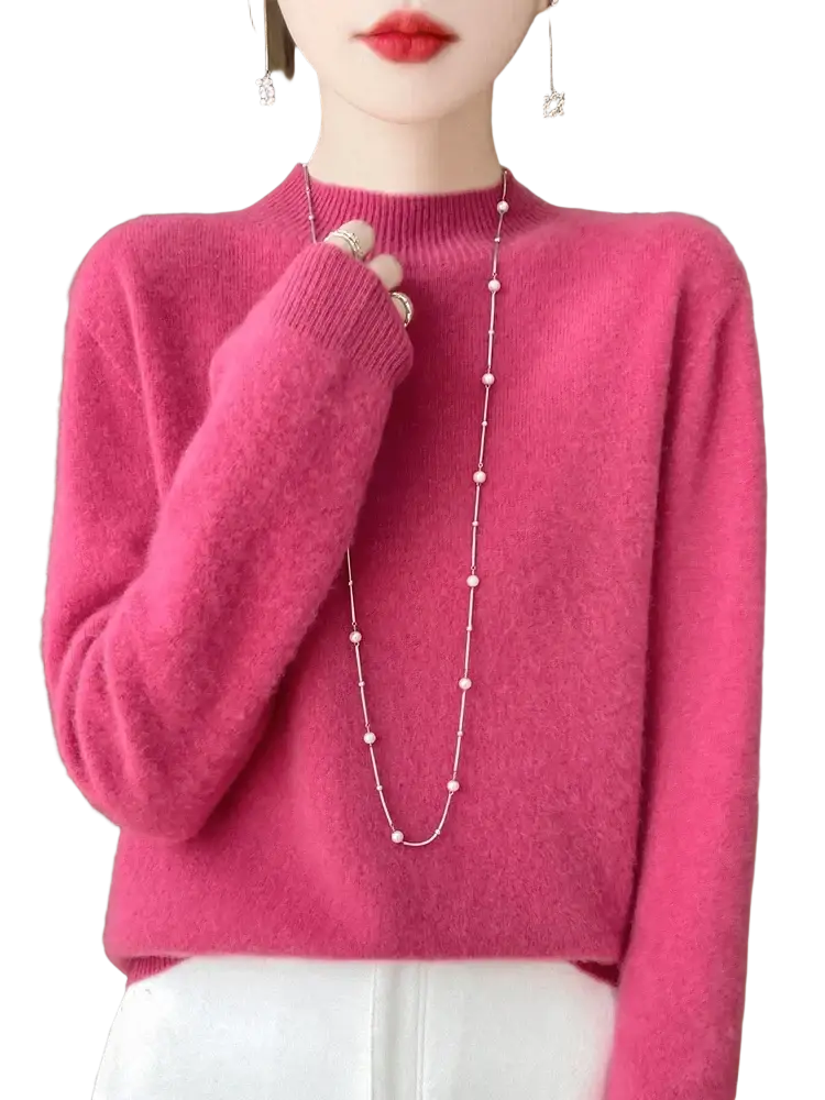 A soft vibrant pink merino wool pullover sweater for women with cozy texture and ribbed cuffs