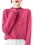 A soft vibrant pink merino wool pullover sweater for women with cozy texture and ribbed cuffs