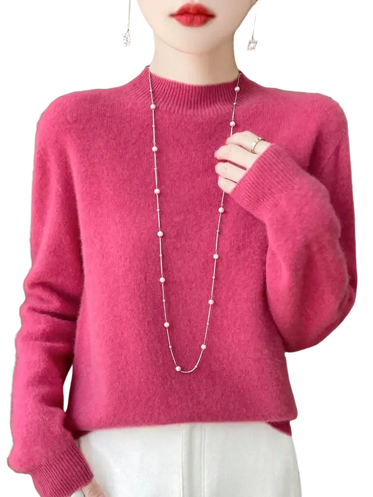 A soft vibrant pink merino wool pullover sweater for women with a ribbed crew neckline and cuffs