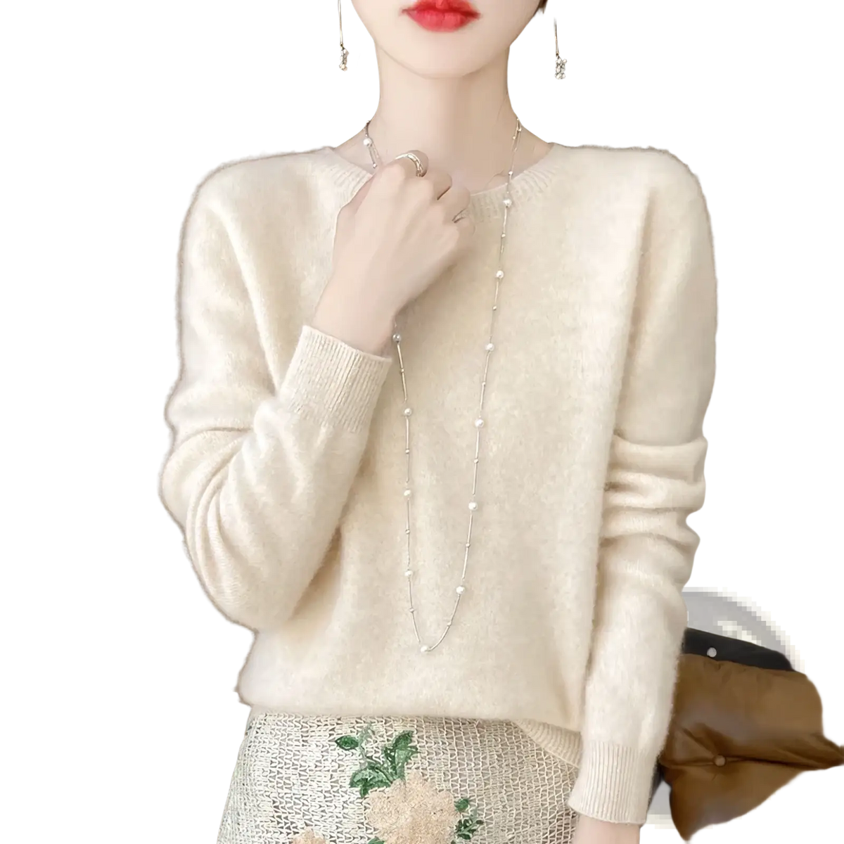 Cream-colored merino wool sweater for women with soft knit texture, long sleeves, and o-neck pullover design