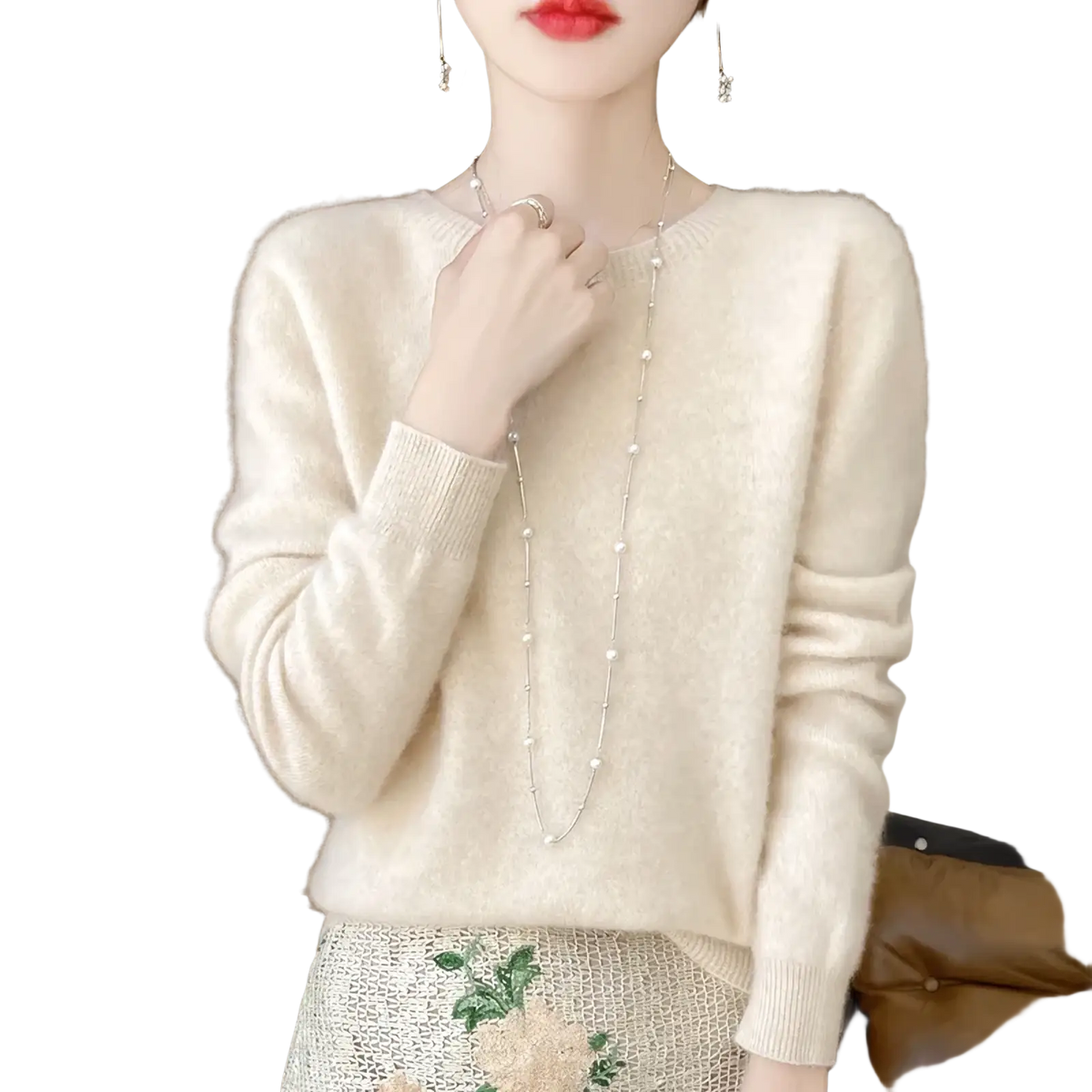 Cream-colored merino wool sweater for women with soft knit texture, long sleeves, and o-neck pullover design
