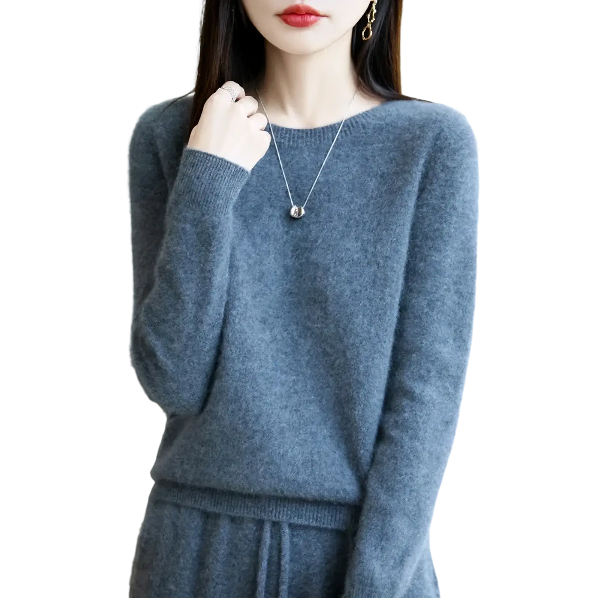 A soft heathered gray merino wool sweater for women with an o-neck pullover design and ribbed cuffs