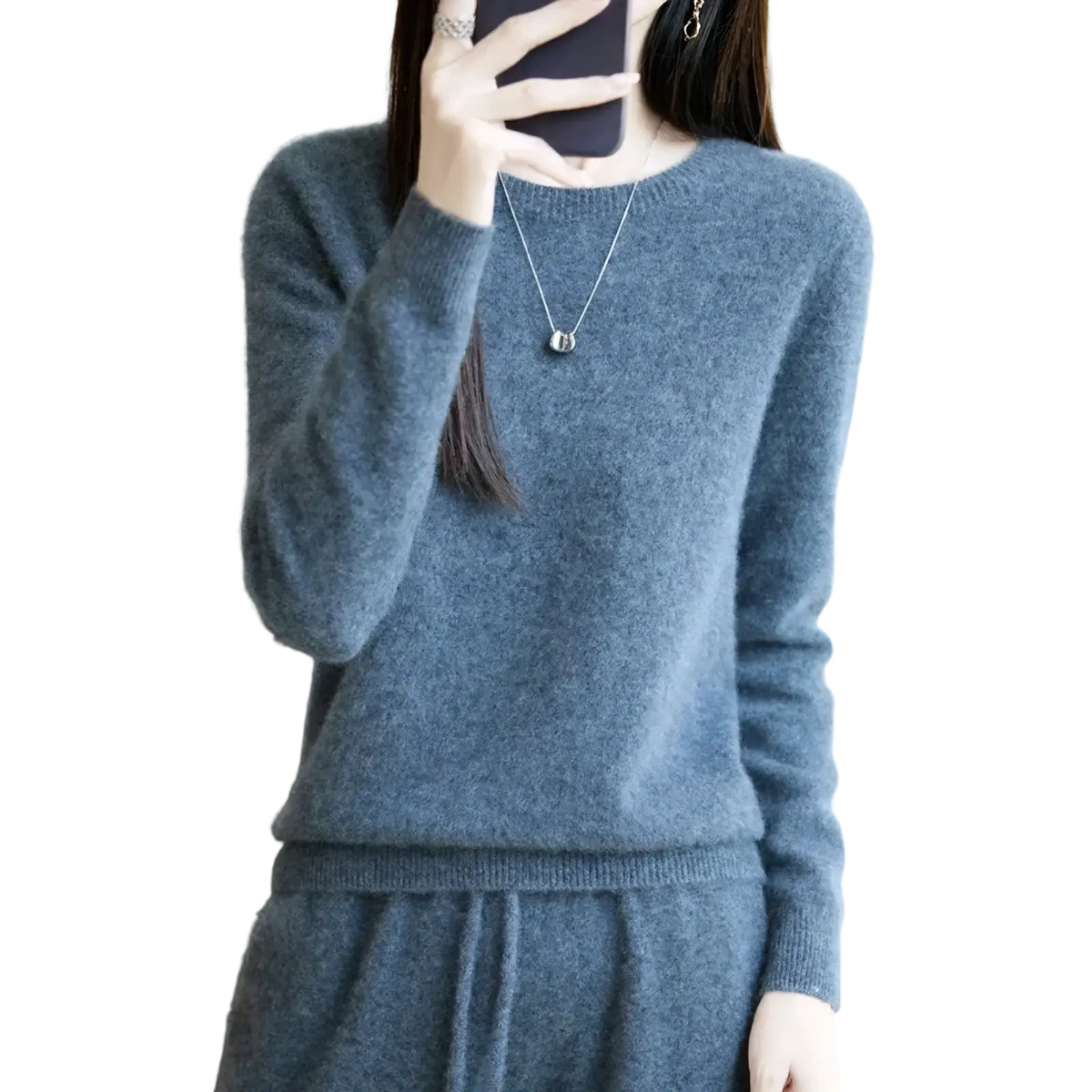 A soft heathered gray merino wool women O-neck pullover sweater with ribbed cuffs and round neckline