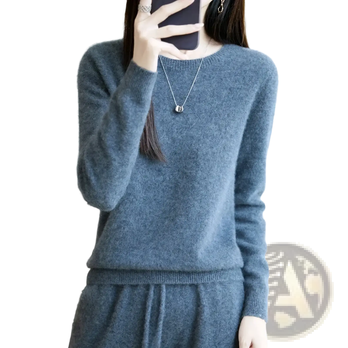 A soft heathered gray merino wool women O-neck pullover sweater with ribbed cuffs and round neckline