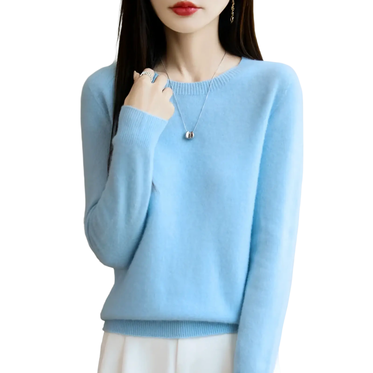 A soft light blue merino wool sweater for women with o-neck pullover and ribbed cuffs is displayed