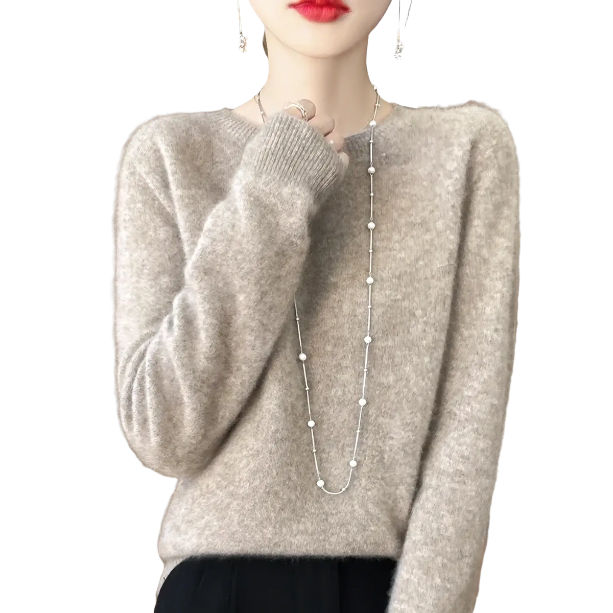 A soft light gray merino wool sweater for women with a cozy texture and ribbed cuffs in an o-neck pullover design