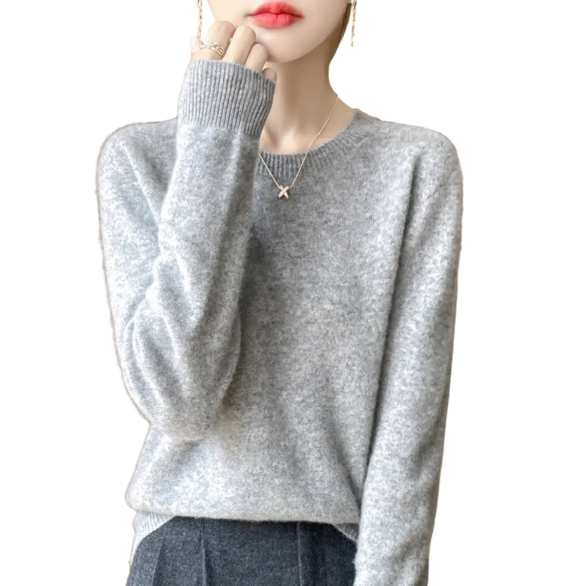 A soft light gray merino wool sweater for women with cozy texture and ribbed cuffs in an O-neck pullover design