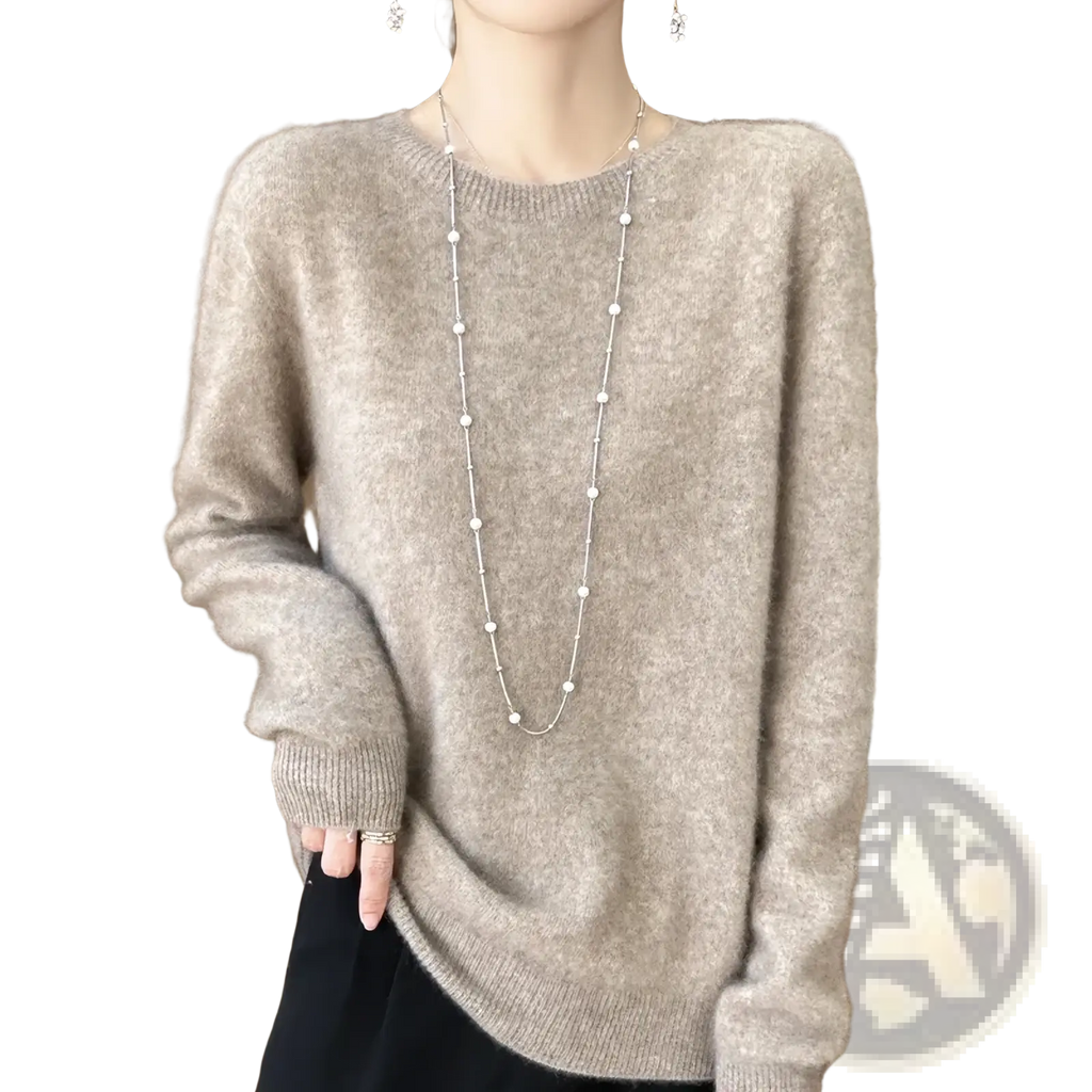 A soft light gray merino wool sweater for women with an o-neck pullover and ribbed cuffs