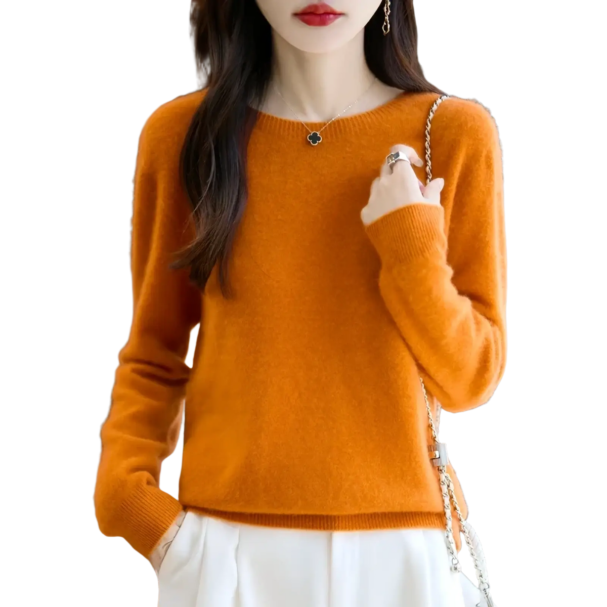 A soft vibrant orange merino wool sweater for women with long sleeves round neckline and ribbed cuffs