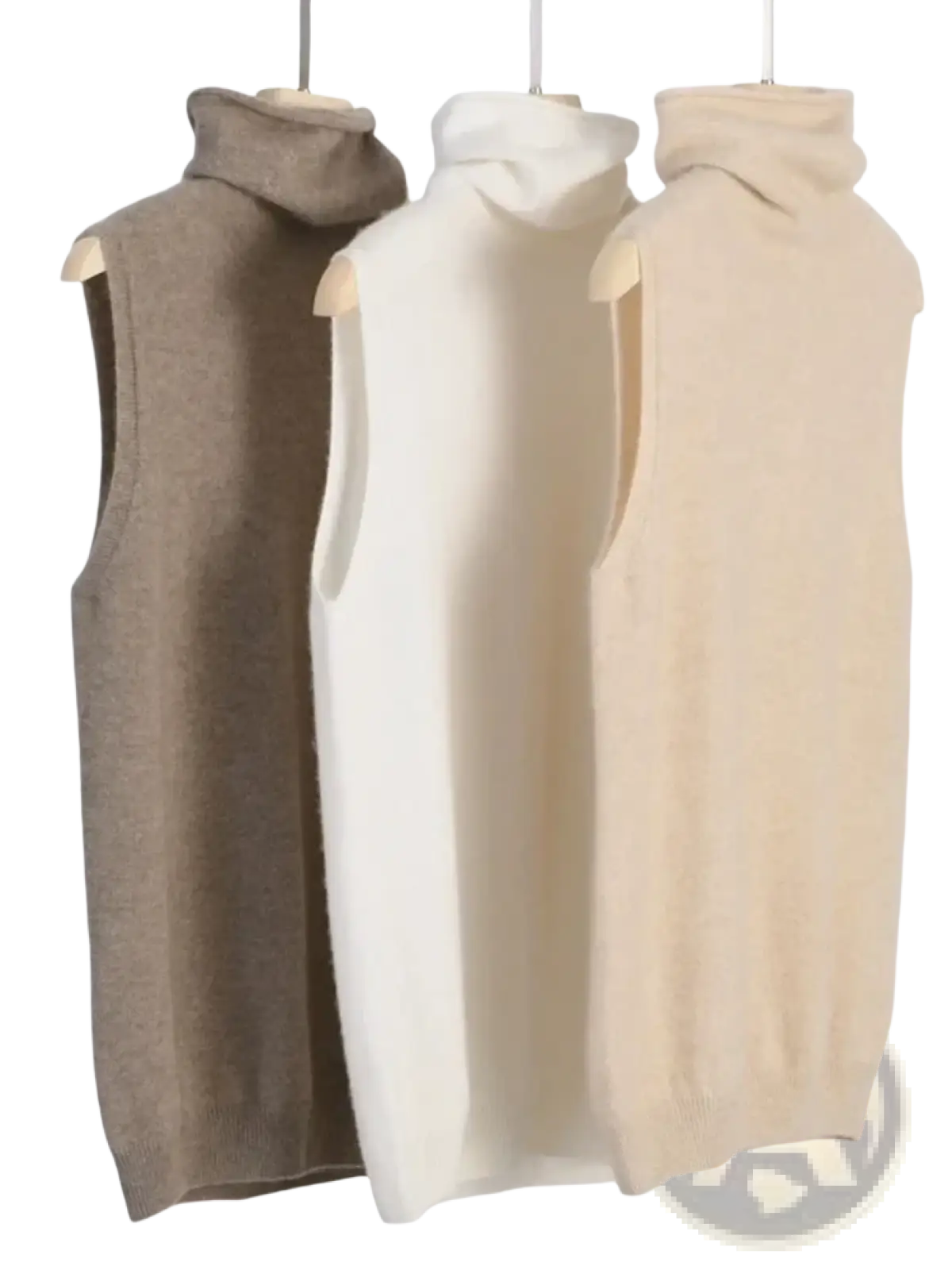 Three sleeveless merino wool turtleneck knit vests in beige cream and taupe displayed on wooden hangers