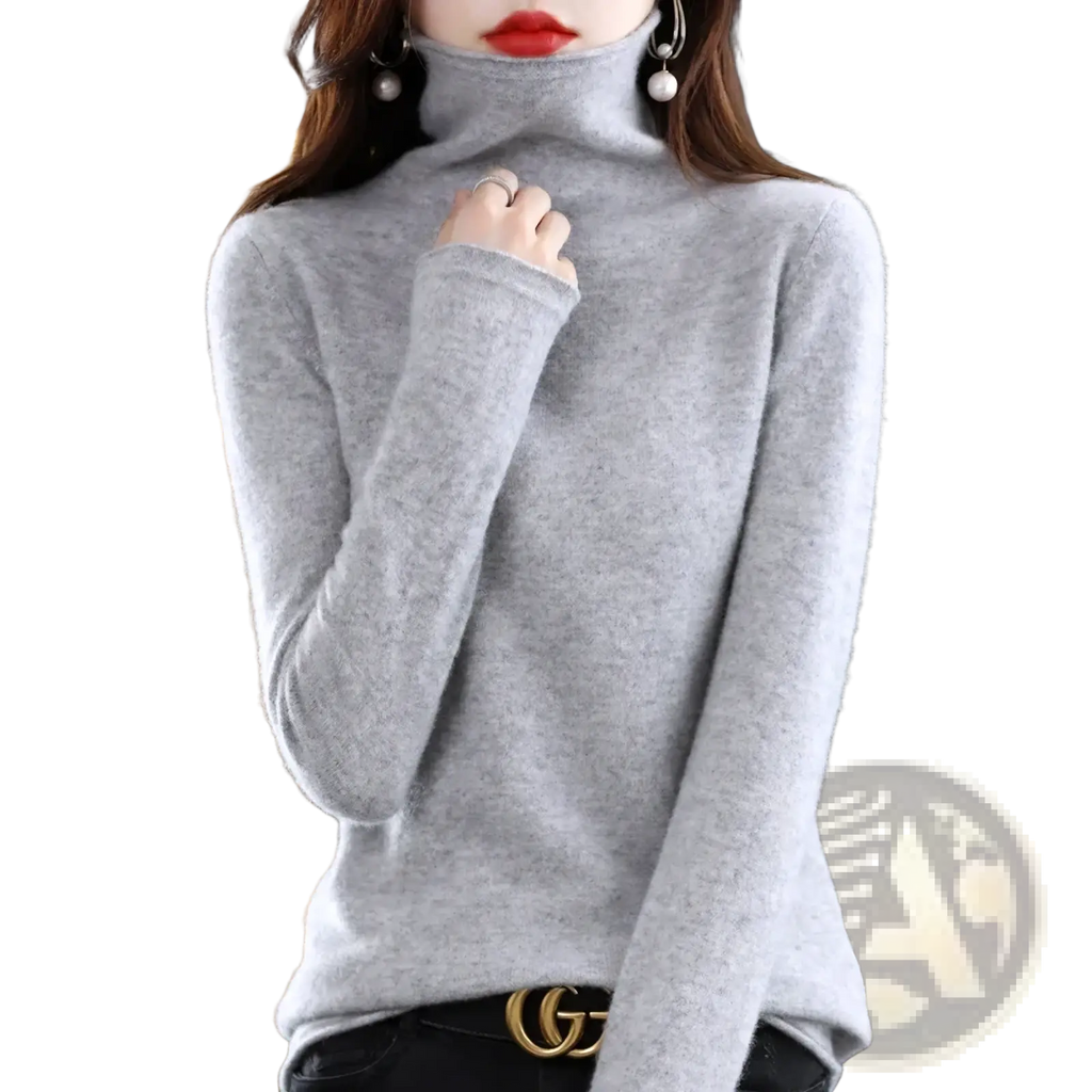 A soft heather gray merino wool turtleneck sweater for women with a smooth fine knit texture