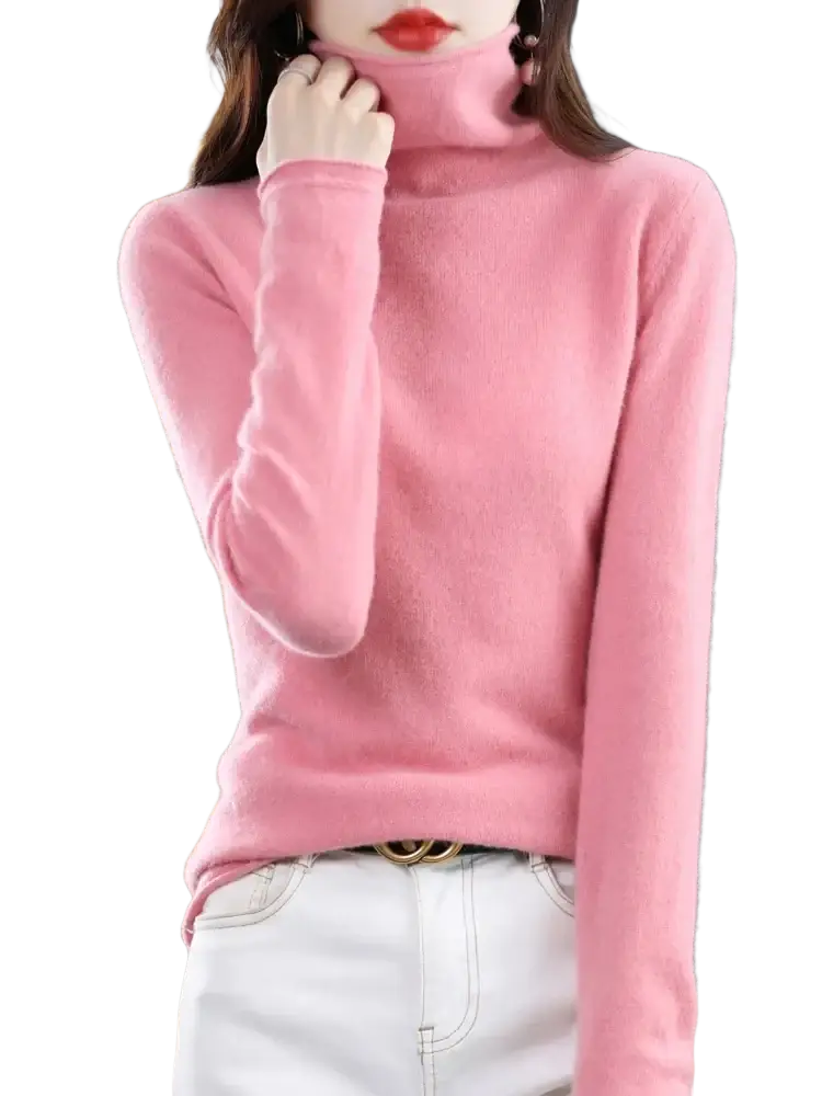 A soft pink merino wool turtleneck sweater for women with long sleeves and a smooth knit texture