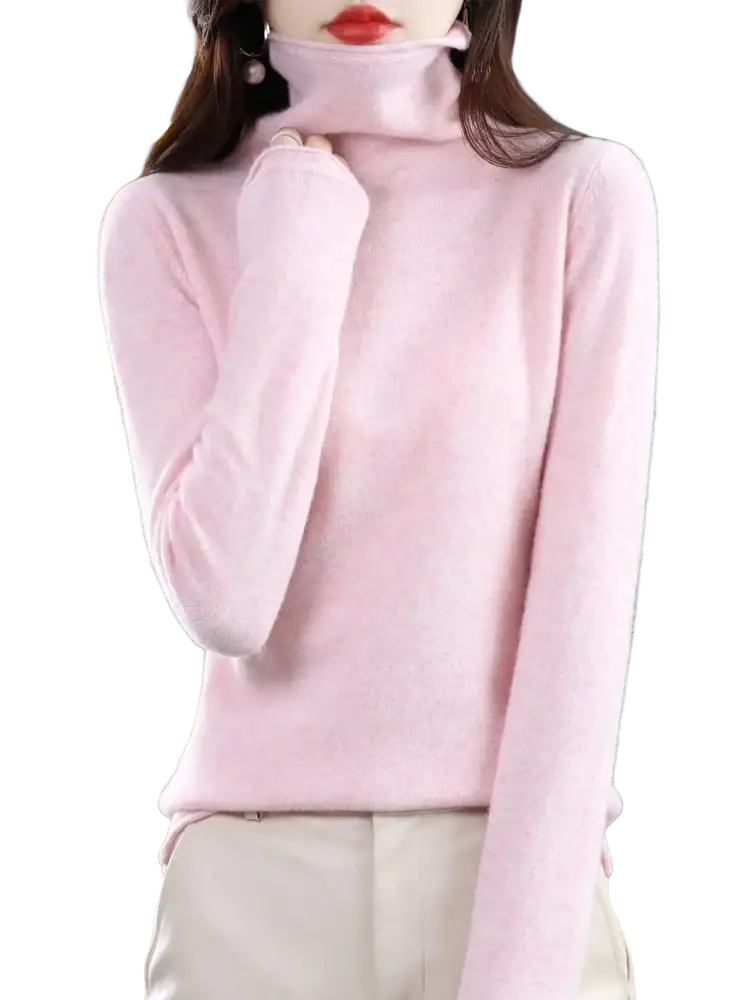 A soft pink merino wool turtleneck sweater for women with long sleeves and smooth knit texture