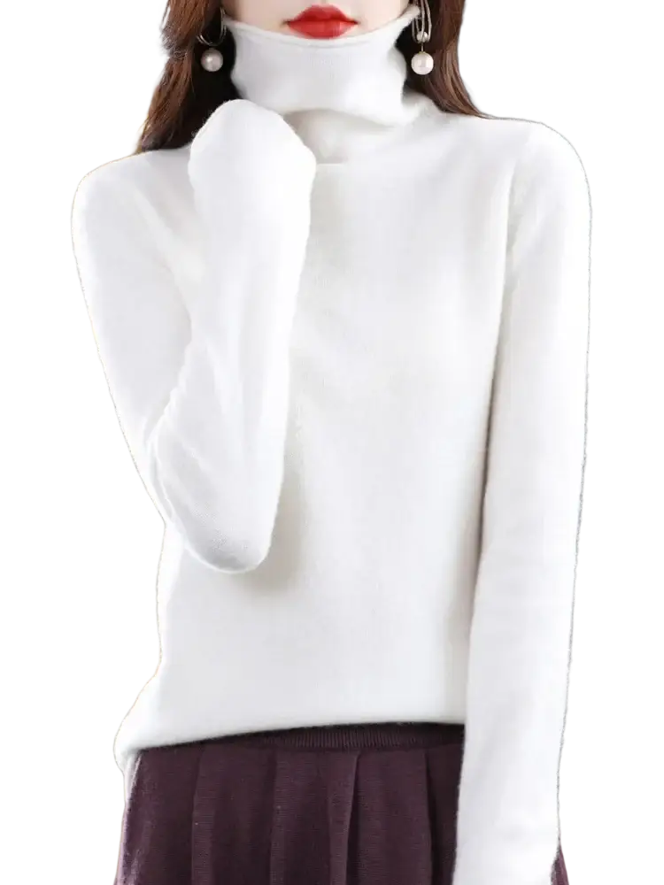 A soft white merino wool turtleneck sweater for women with a plush textured knit design