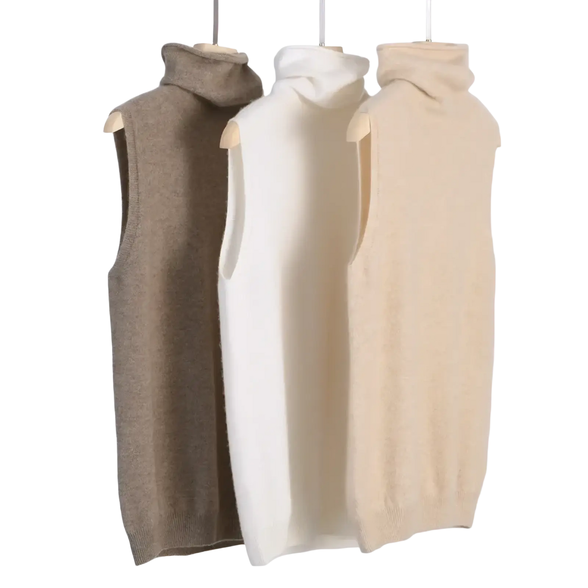 Three sleeveless merino wool turtleneck vests in beige cream and taupe displayed on wooden hangers for women slim knit base layer