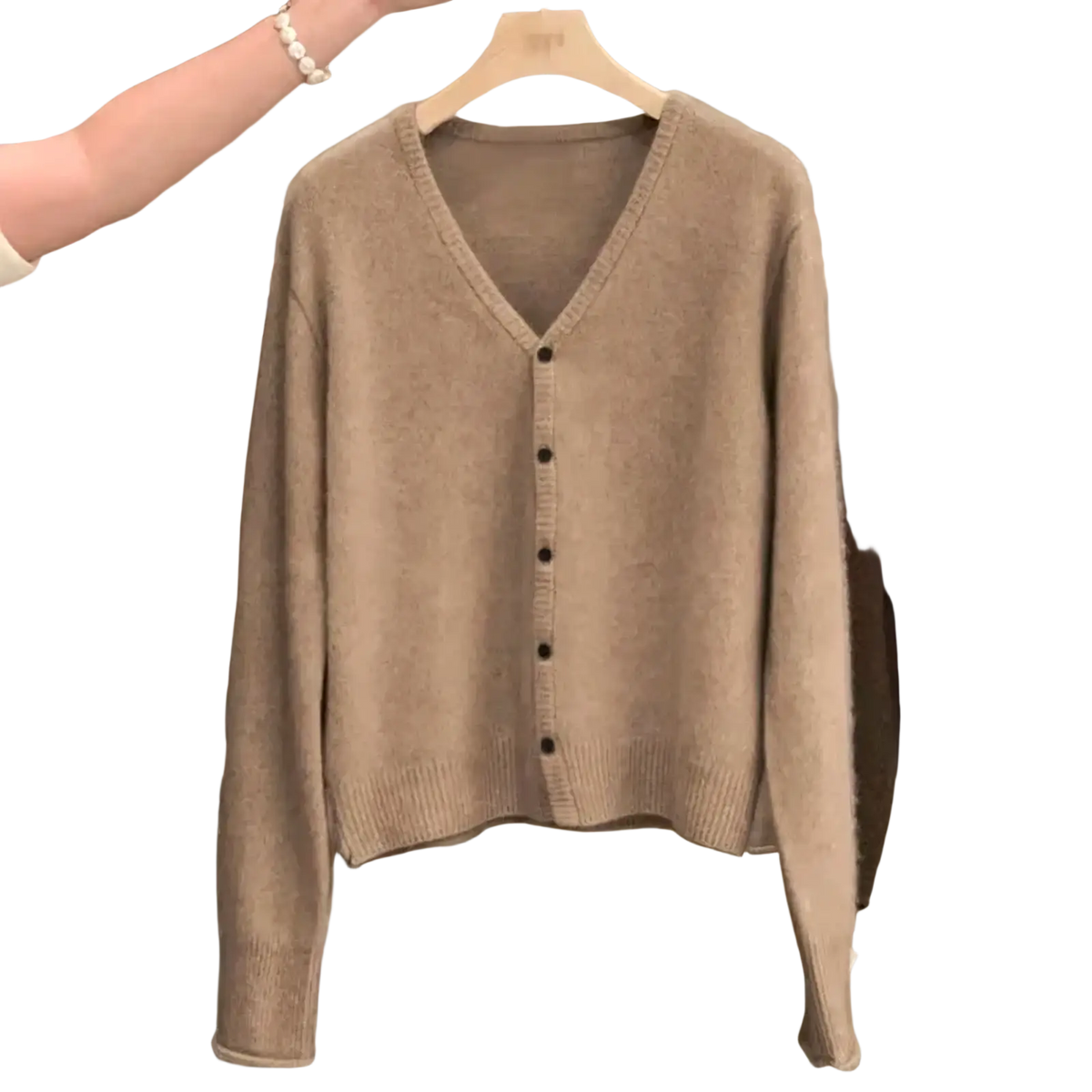 Beige merino wool v-neck cardigan sweater with black buttons and ribbed cuffs for versatile layering