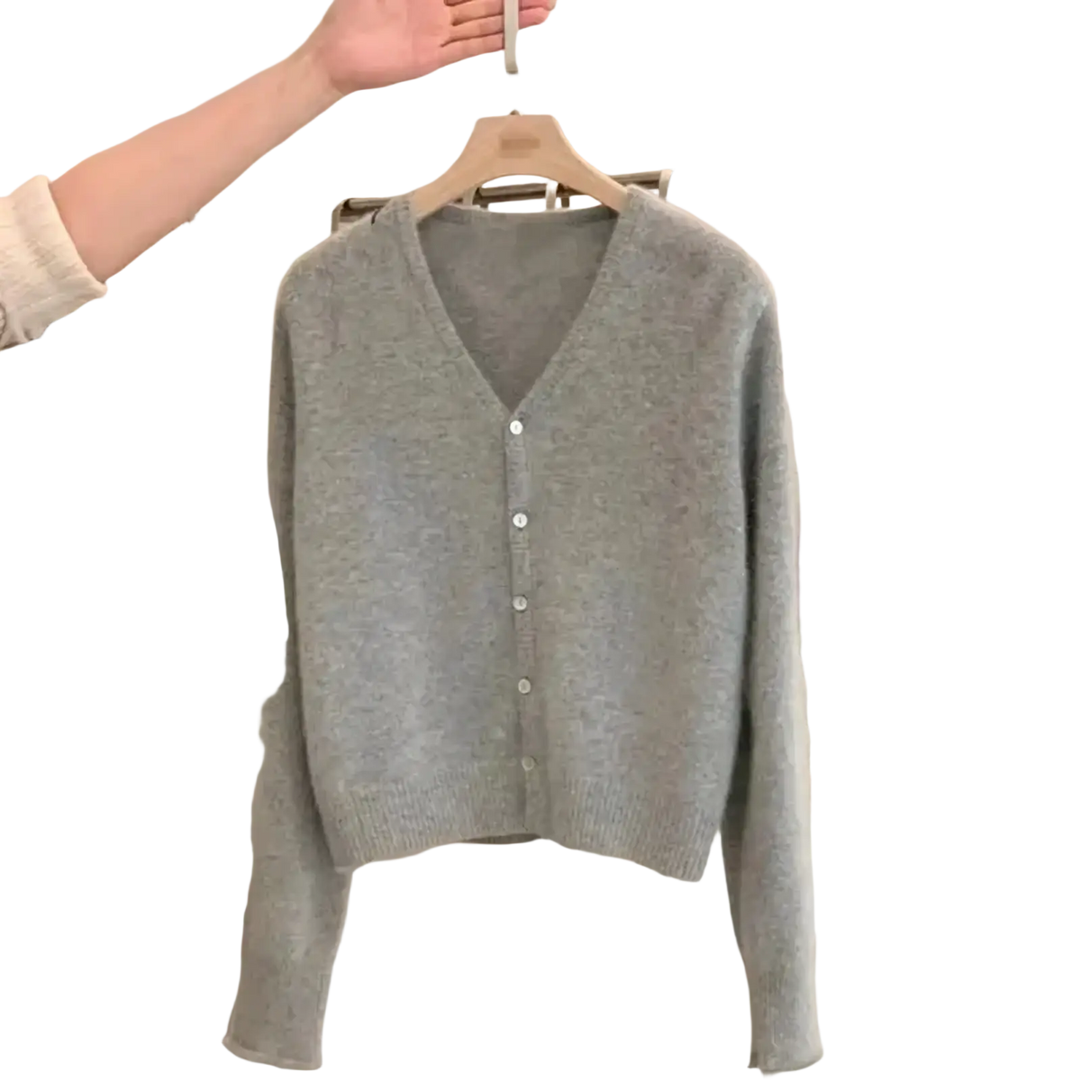 A soft heather gray merino wool v-neck cardigan sweater with button-front closure and long sleeves
