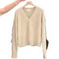 A soft off-white merino wool v-neck cardigan sweater with long sleeves and button-front closure