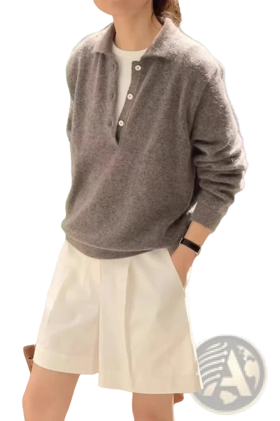 A soft gray fuzzy knit polo sweater with collar and button closure made from merino wool for women
