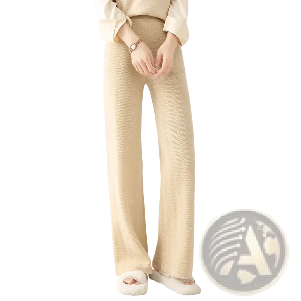 Beige merino wool wide leg pants featuring a subtle herringbone pattern and a slightly shimmering knit texture