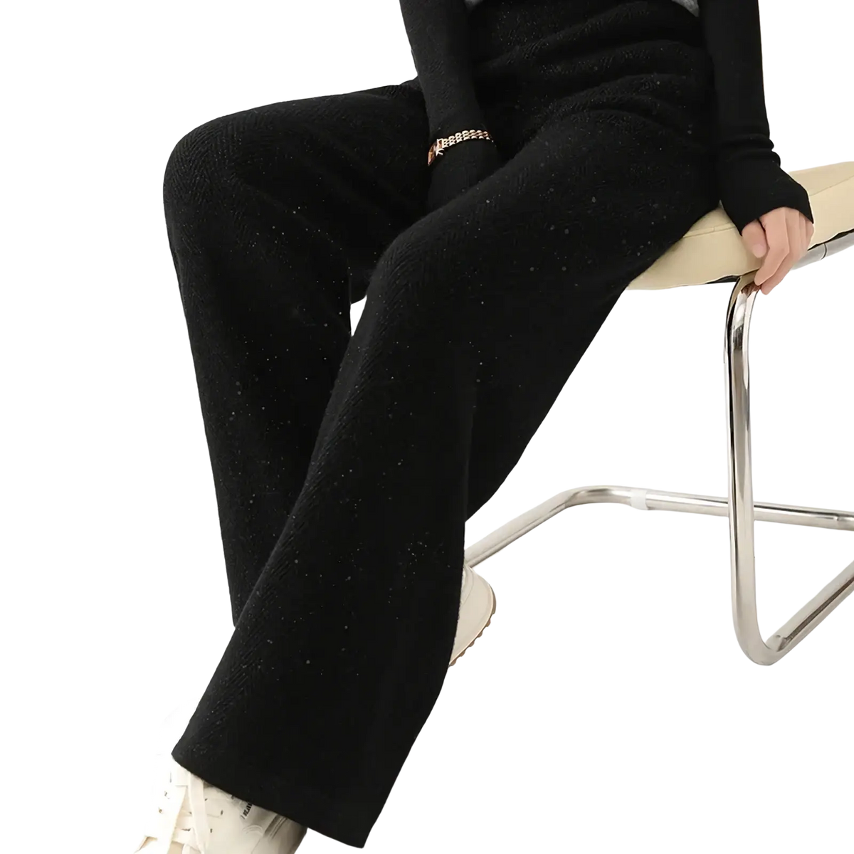 Black merino wool wide leg pants with a subtle shimmering knit texture for elegant comfort and style