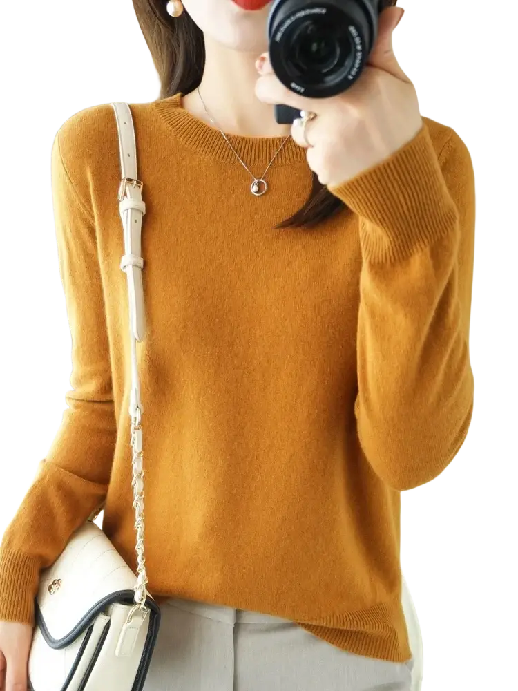 A cozy mustard yellow merino wool women casual pullover sweater with ribbed cuffs and neckline