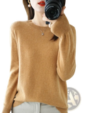 A camel-colored soft cashmere sweater with round neckline and ribbed cuffs for women casual wear