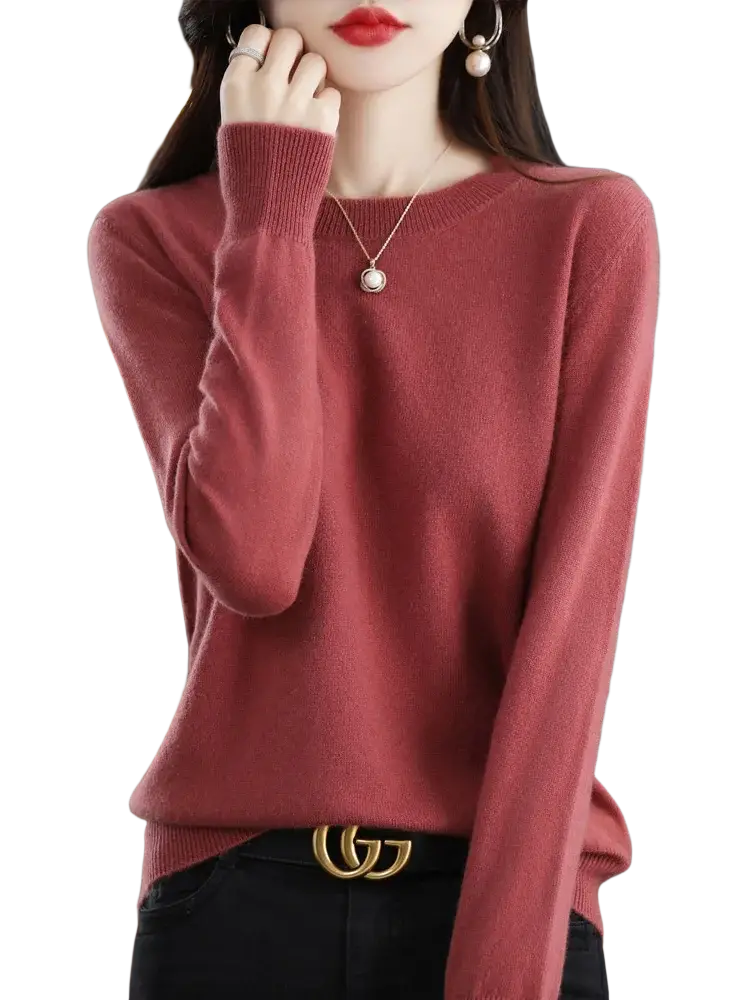 A soft dusty rose merino wool women casual pullover sweater with long sleeves round neckline and ribbed cuffs