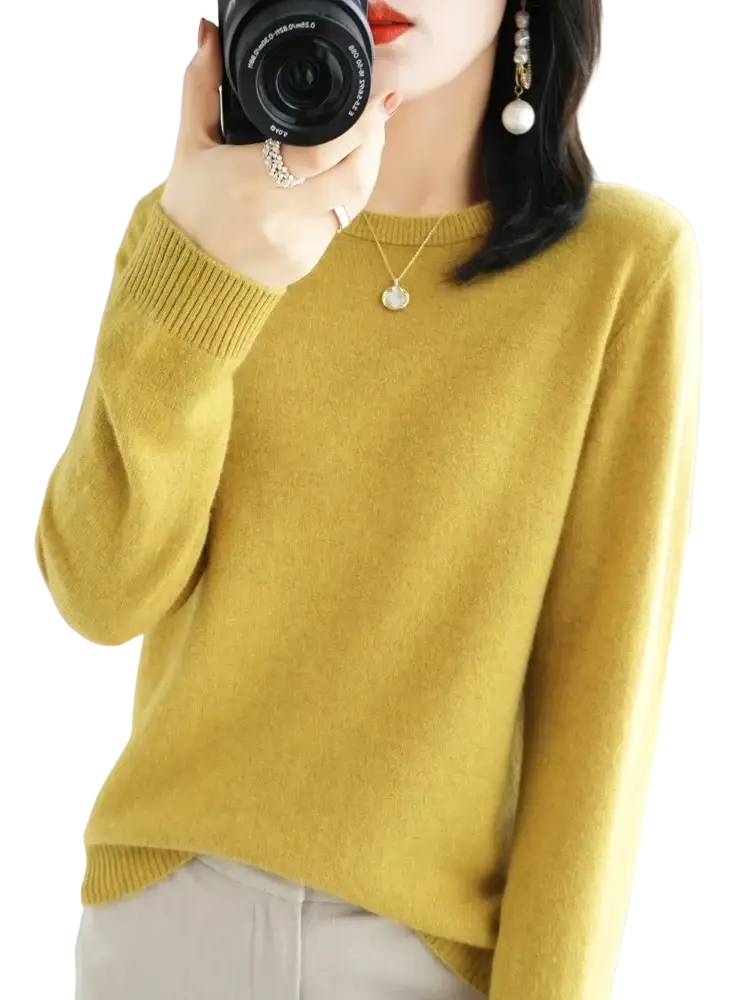 A soft mustard yellow merino wool casual pullover sweater with ribbed neckline and cuffs for women
