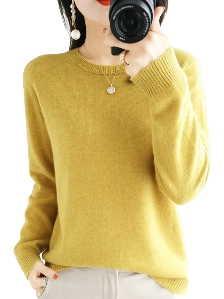A soft mustard-yellow merino wool women casual pullover sweater with ribbed cuffs and neckline