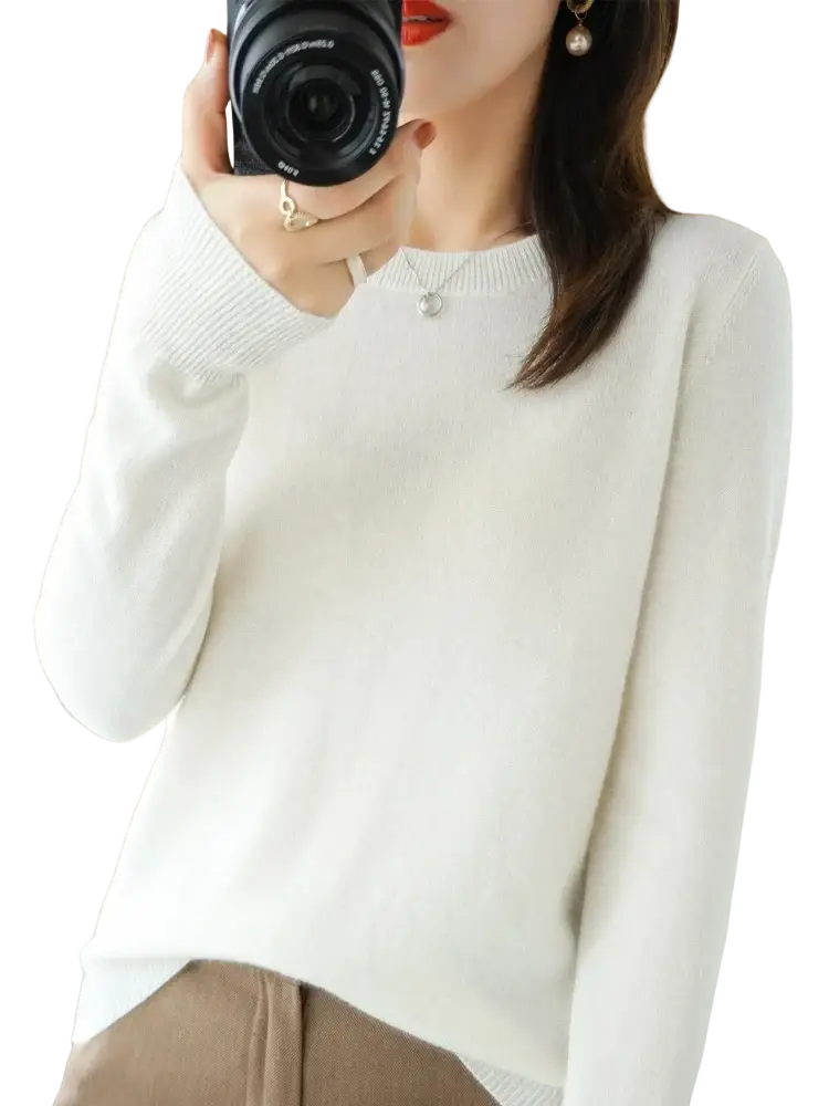 A soft white merino wool women casual pullover sweater with long sleeves round neckline and ribbed cuffs