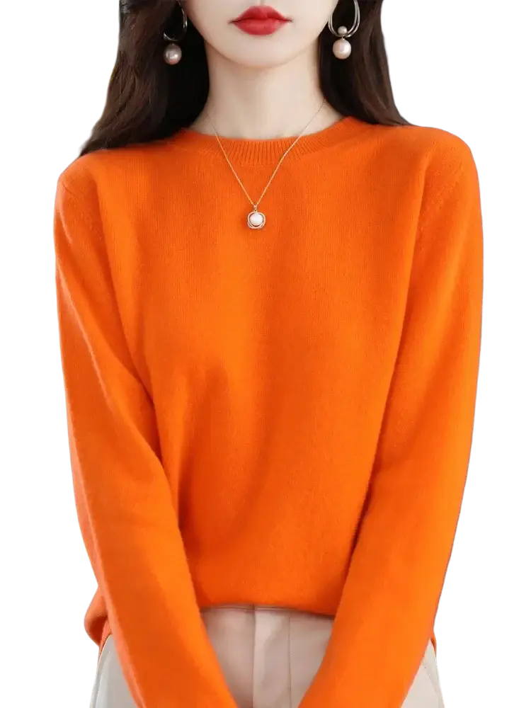 A vibrant orange merino wool women casual pullover sweater with long sleeves round neckline and ribbed texture