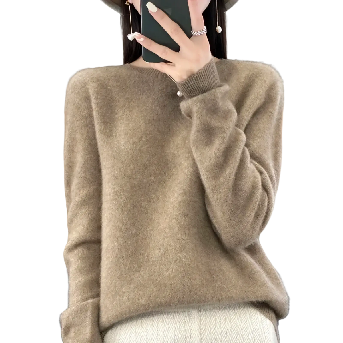 A soft beige merino wool women sweater o neck pullover top with cozy fluffy texture and ribbed cuffs