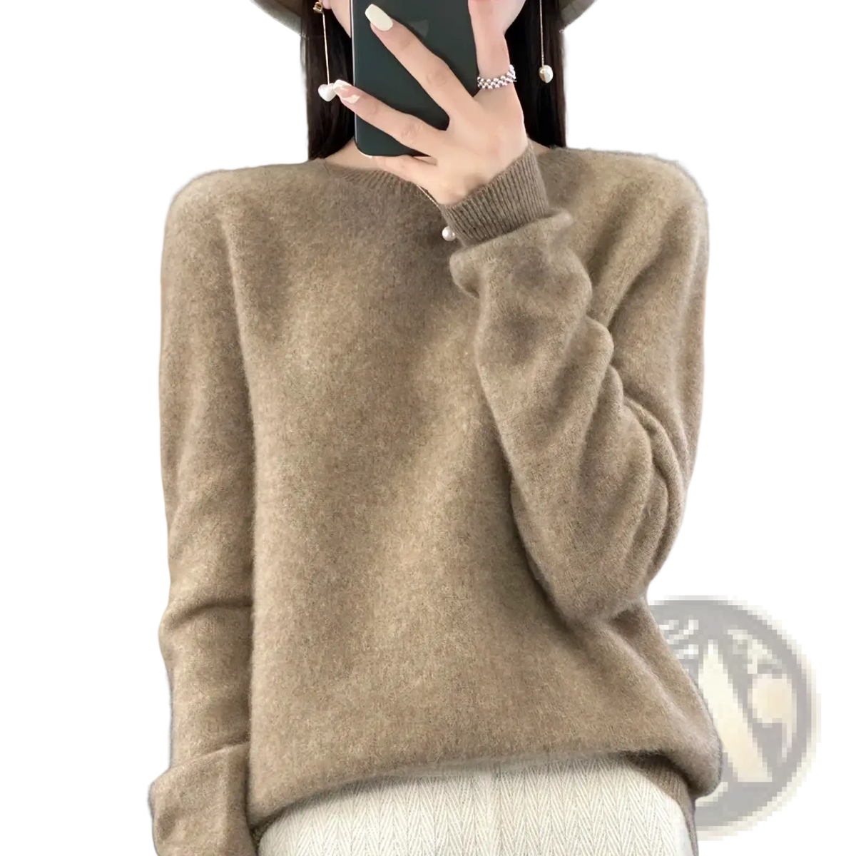 A soft beige merino wool women sweater o neck pullover top with cozy fluffy texture and ribbed cuffs