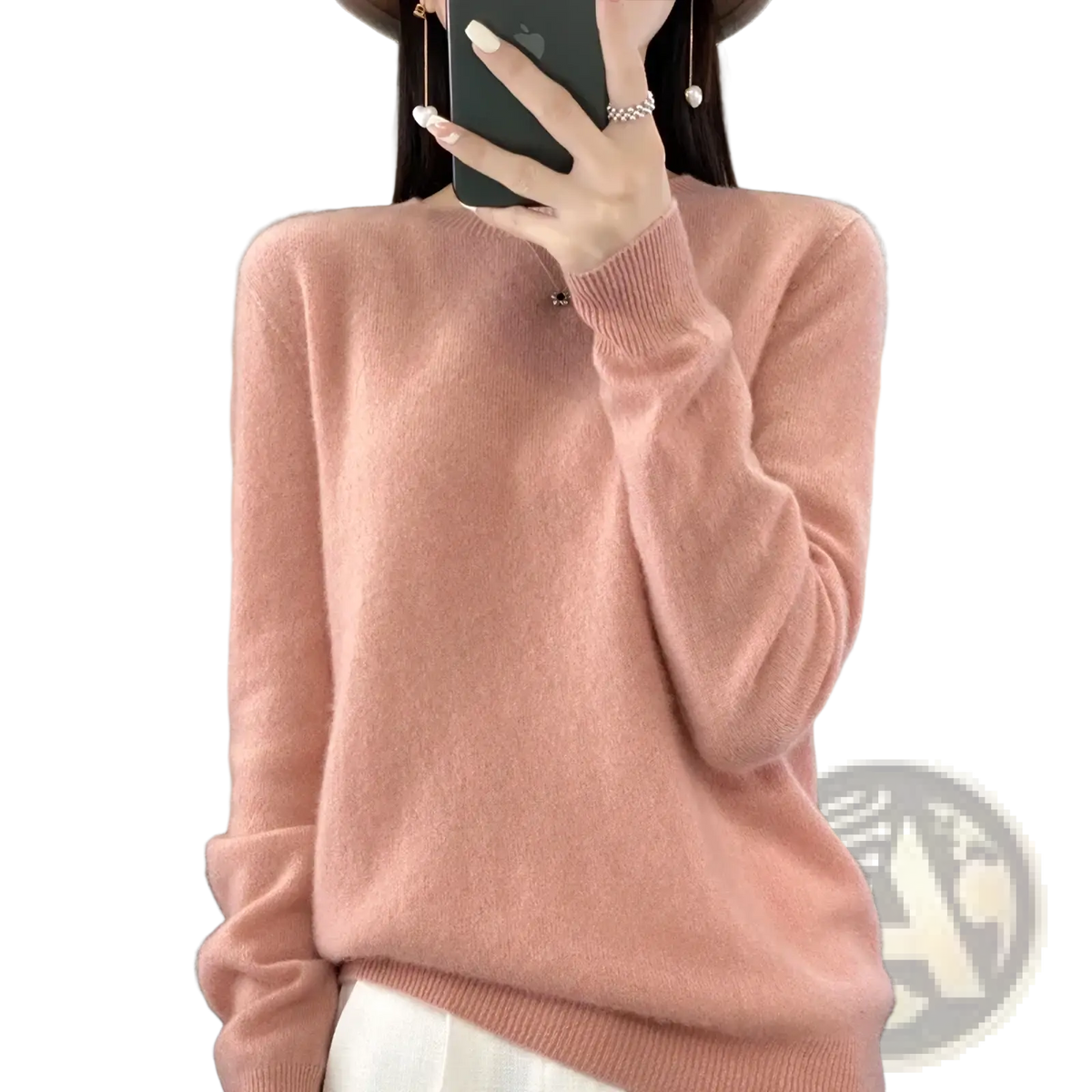 A soft pink merino wool women sweater o neck pullover top with long sleeves and ribbed neckline and cuffs