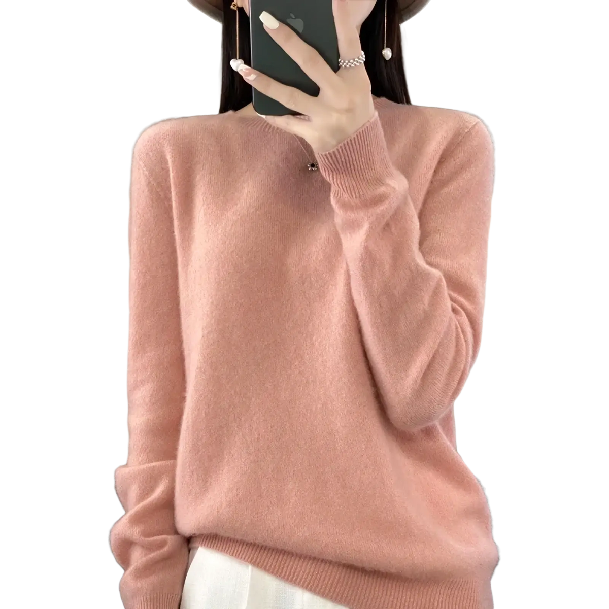 A soft pink merino wool women sweater o neck pullover top with long sleeves and ribbed neckline and cuffs