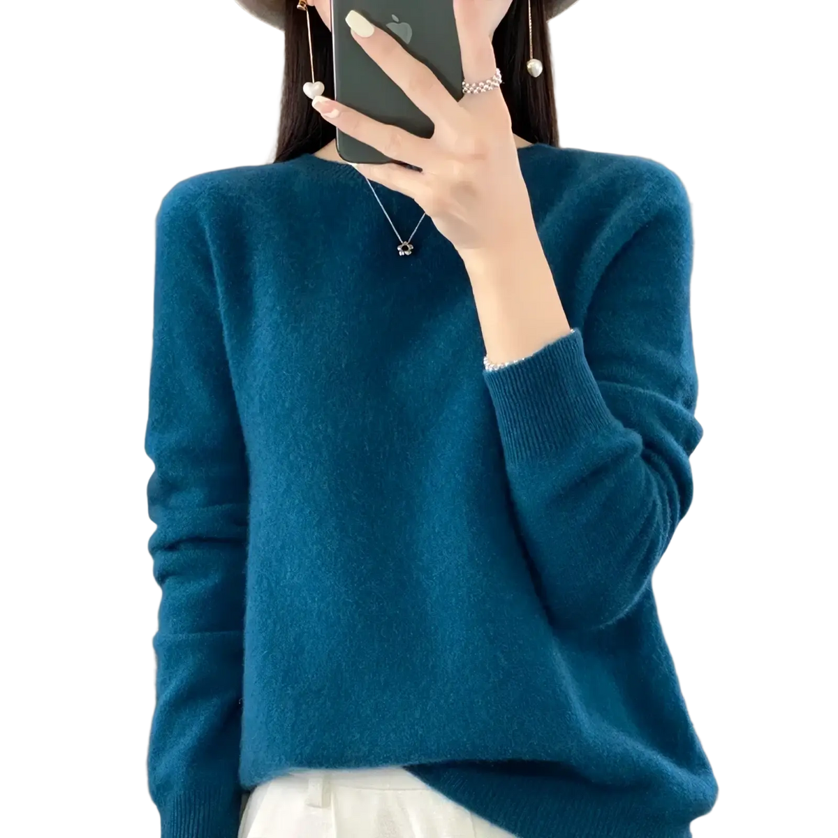 A soft teal merino wool women sweater with long sleeves ribbed cuffs and a cozy knit texture o neck pullover top