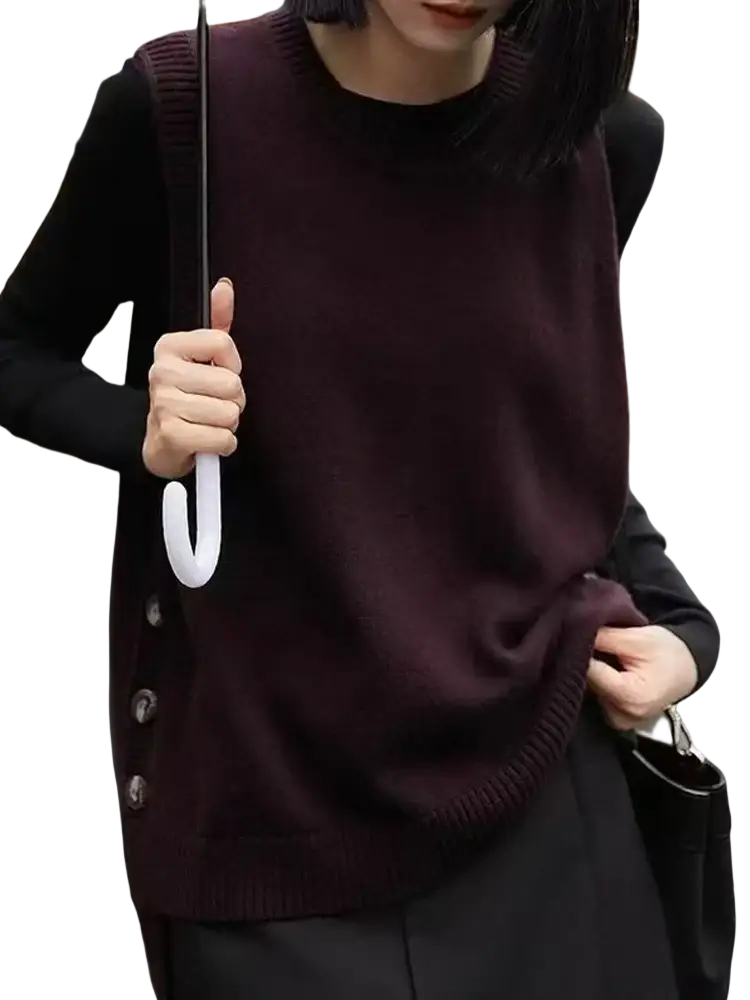 A dark burgundy merino wool sleeveless sweater vest with round neckline and button closures for women
