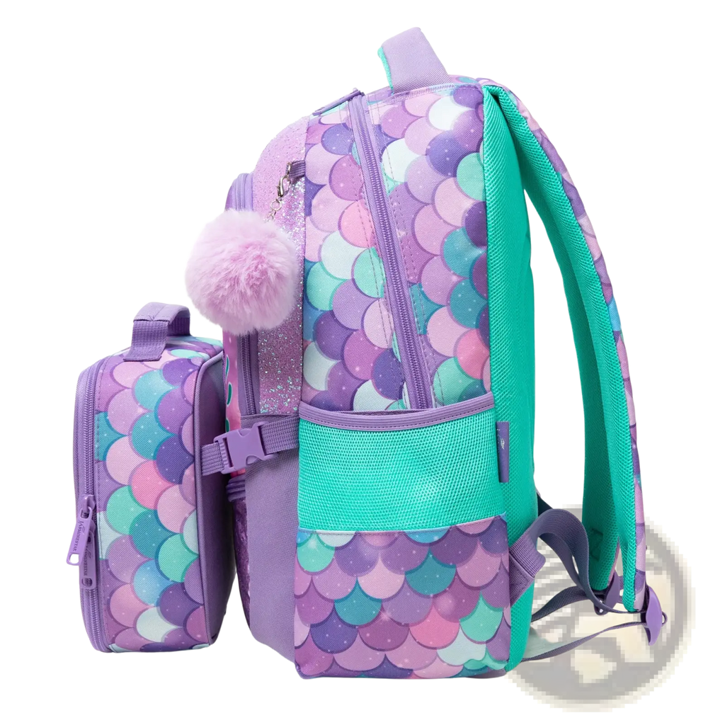 Purple and teal mermaid scale patterned girls school backpack with fluffy pom pom accent and matching lunch box
