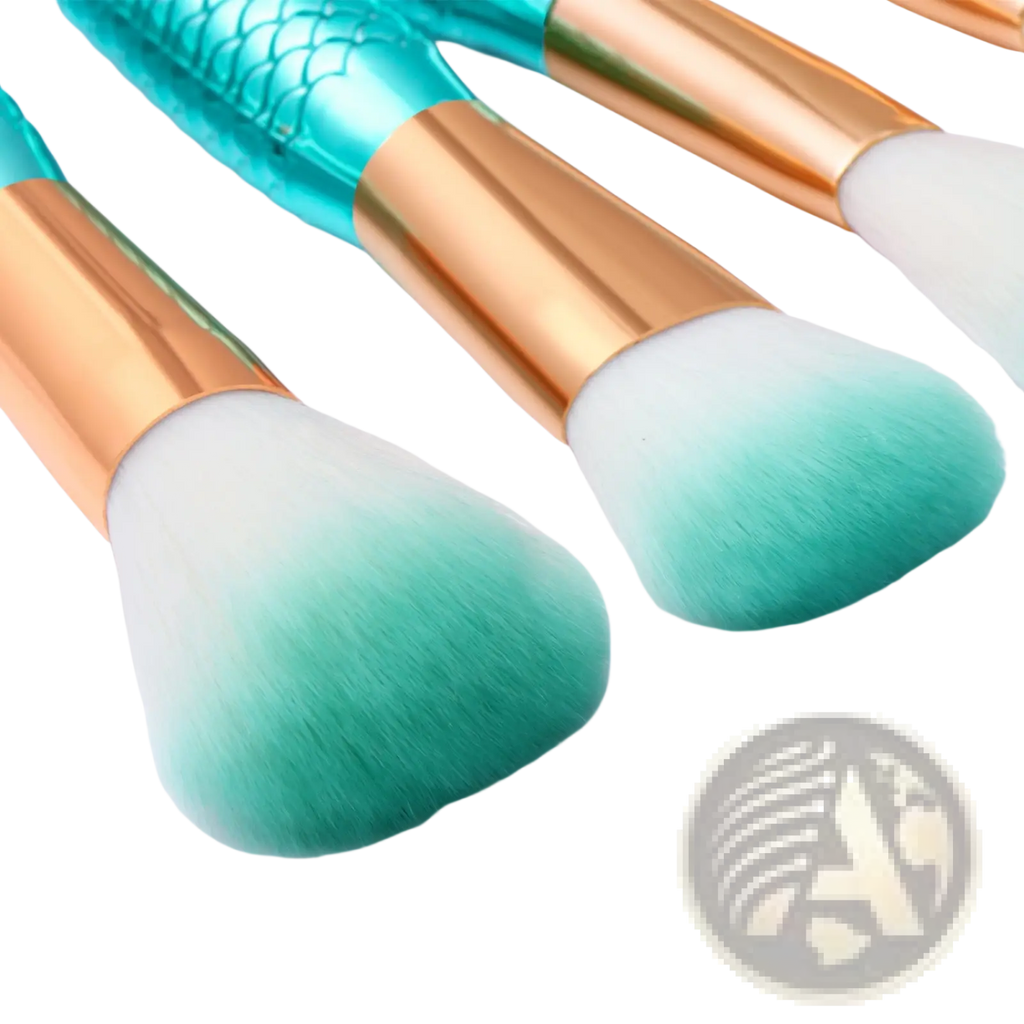 Set of three teal and gold mermaid-scale handle makeup brushes with gradient green synthetic fiber bristles for cosmetic use