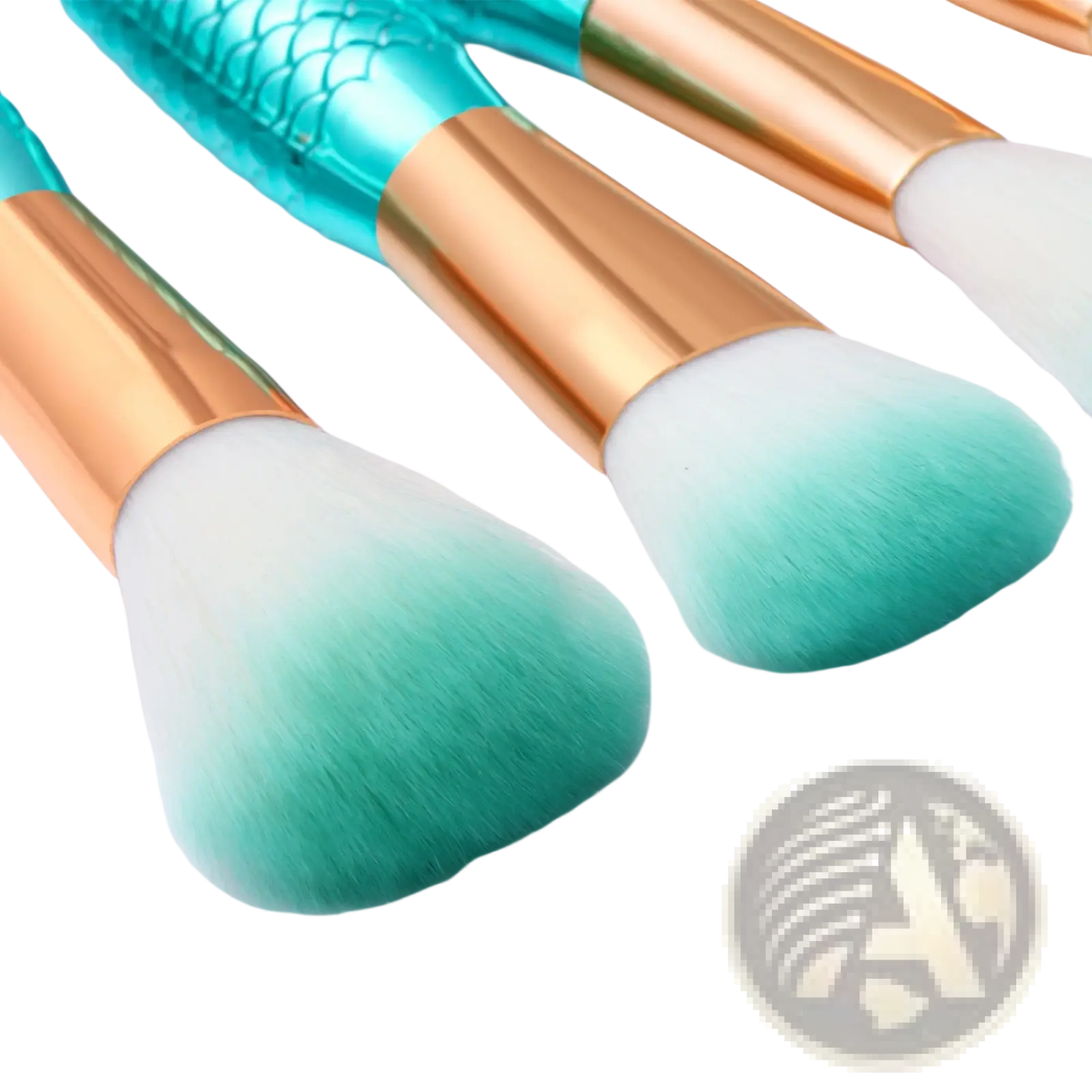 Set of three teal and gold mermaid-scale handle makeup brushes with gradient green synthetic fiber bristles for cosmetic use