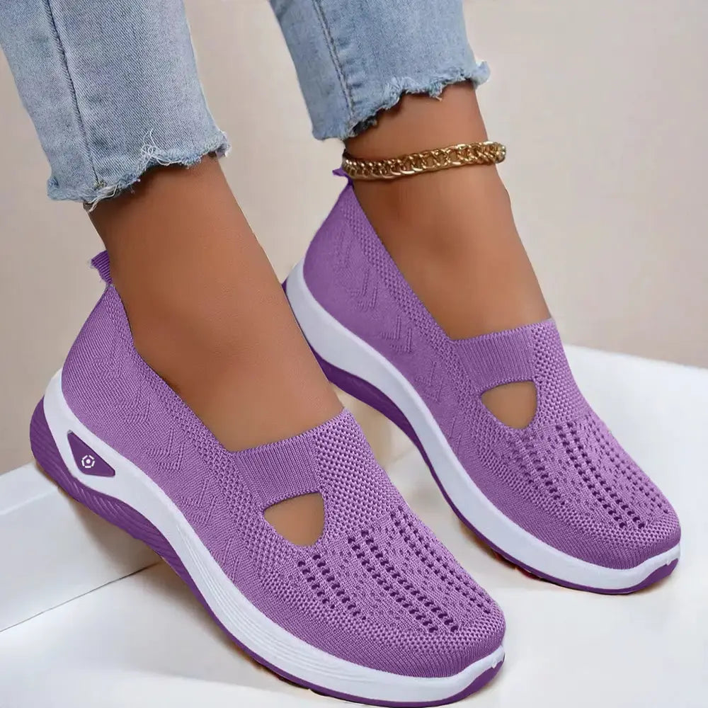 Women’s breathable mesh slip on casual flats in purple knitted fabric with white rubber sole and decorative toe cutouts