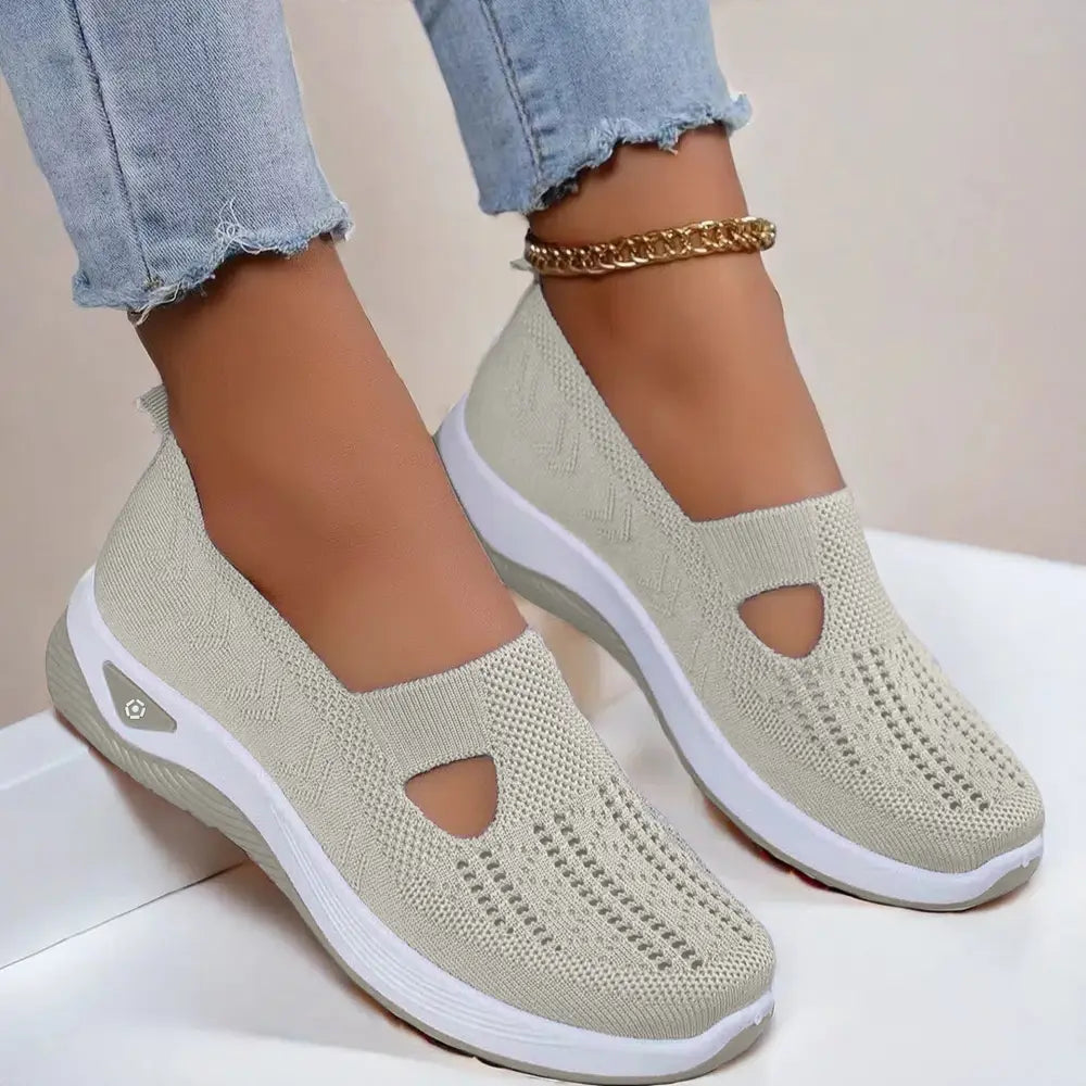 Beige knit women’s breathable mesh slip on casual flats with white rubber sole and decorative toe cutouts