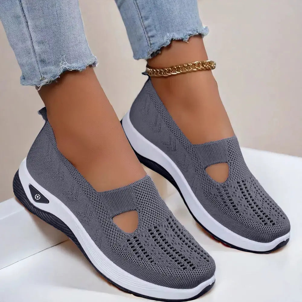 Women’s breathable mesh slip-on casual flats in gray knit with white and black rubber sole and t-strap design
