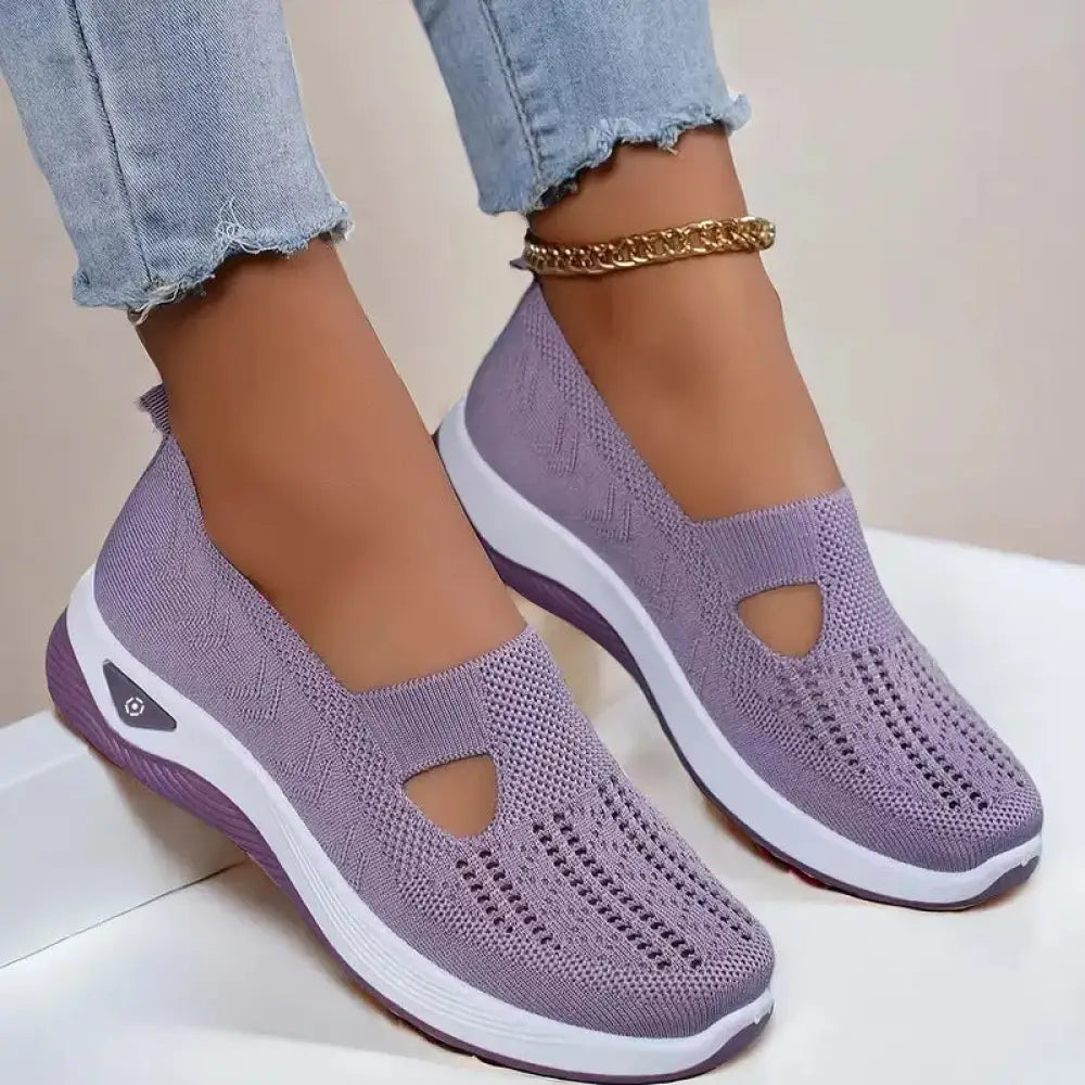 Women’s breathable mesh slip on casual flats in purple knit with white and purple sole and decorative side cutout